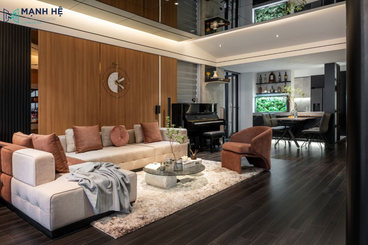 Thi công nội thất phòng khách chung cư với sofa chữ L và bàn trà hiện đại