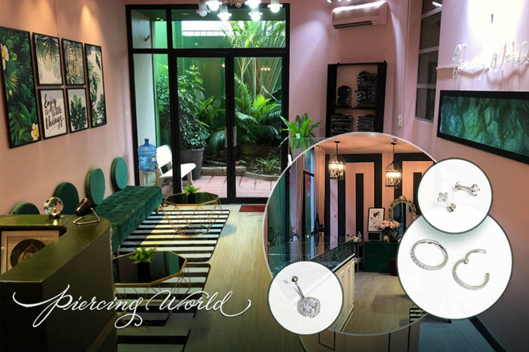Thợ chuyên nghiệp thực hiện bắn lỗ tai tại Piercing World