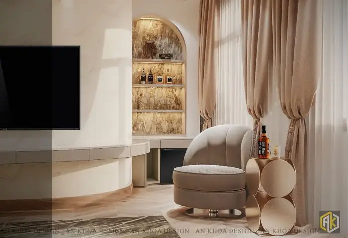 Một Góc Thư Giãn Sang Trọng Và Ấm Cúng Với Chiếc Ghế Bành Charlotte Mềm Mại Đặt Cạnh Chiếc Bàn Tròn Kim Loại Độc Đáo, Nơi Bày Biện Đồ Uống Tinh Tế