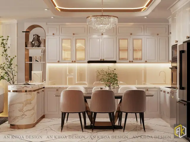 Một Không Gian Bếp Và Ăn Uống Sang Trọng Với Tủ Bếp Trắng Tinh Tế Kết Hợp Cùng Mặt Đá Cẩm Thạch Và Các Chi Tiết Mạ Vàng Lấp Lánh