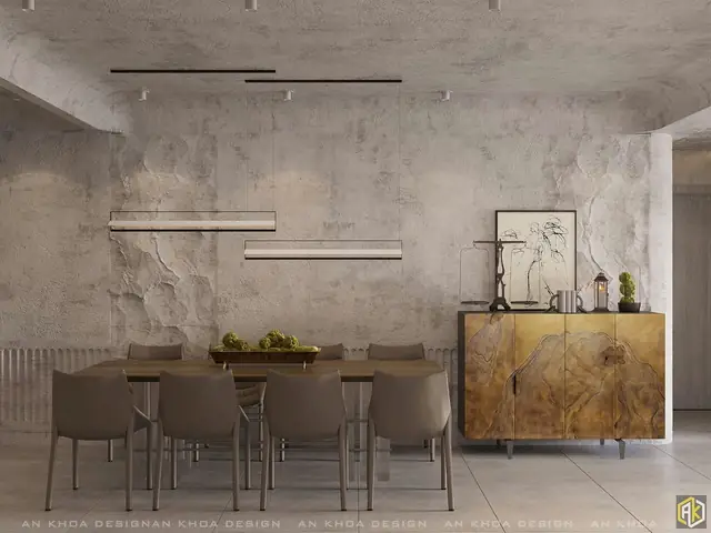 Một Phòng Ăn Mang Phong Cách Industrial Mạnh Mẽ Với Bức Tường Xi Măng Thô Ráp Làm Nổi Bật Bộ Bàn Ghế Gỗ Tối Giản